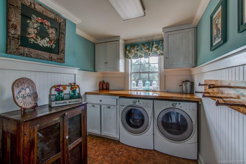 4031 Tite Road Stanfield, NC 28163 - Photo 3 of 24 a utility room with dryer and washer
