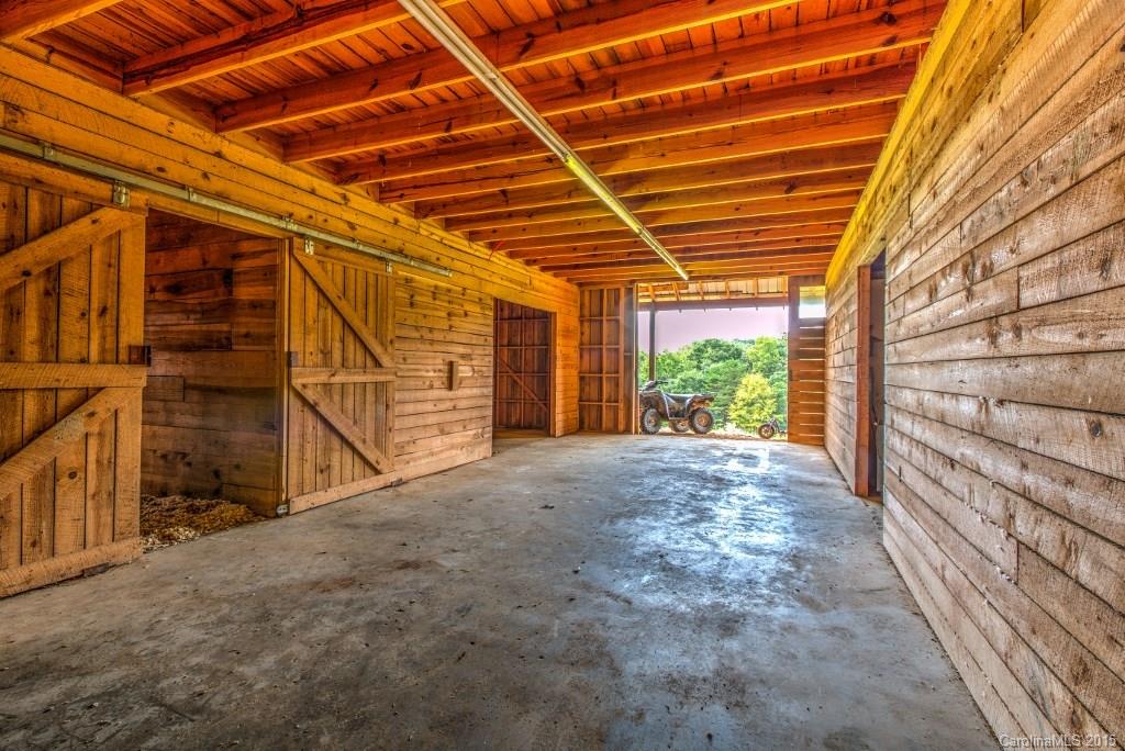 4031 Tite Road Stanfield, NC 28163 - Photo 21 of 24 a view of a room with wooden walls