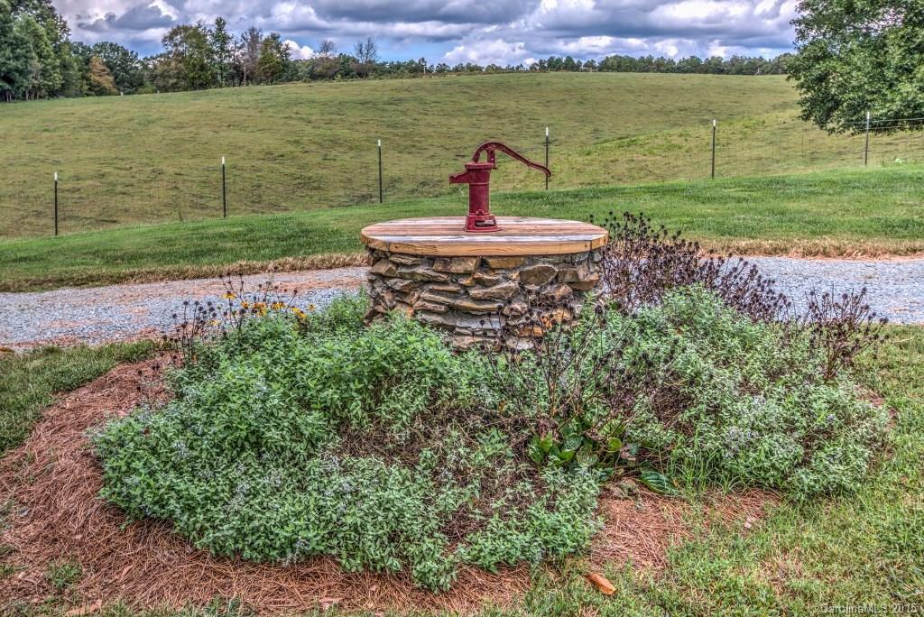 4031 Tite Road Stanfield, NC 28163 - Photo 22 of 24 a view of a lake with a big yard
