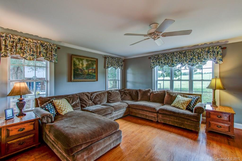 4031 Tite Road Stanfield, NC 28163 - Photo 6 of 24 a living room with furniture and a large window