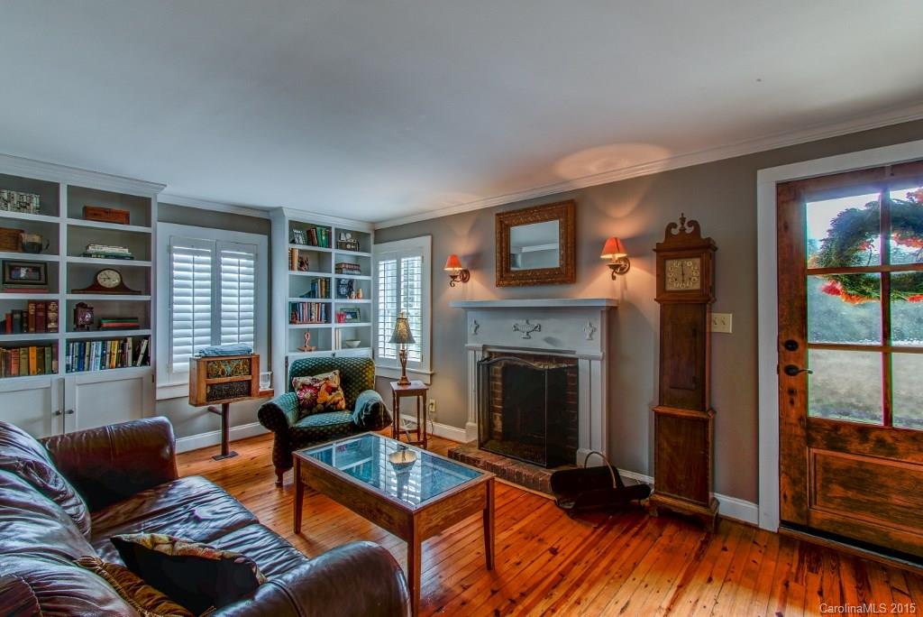 4031 Tite Road Stanfield, NC 28163 - Photo 7 of 24 a living room with furniture and a fireplace