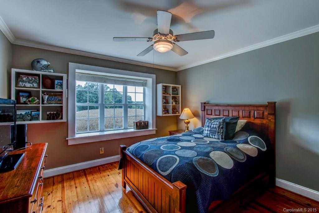 4031 Tite Road Stanfield, NC 28163 - Photo 10 of 24 a bedroom with a bed and a window