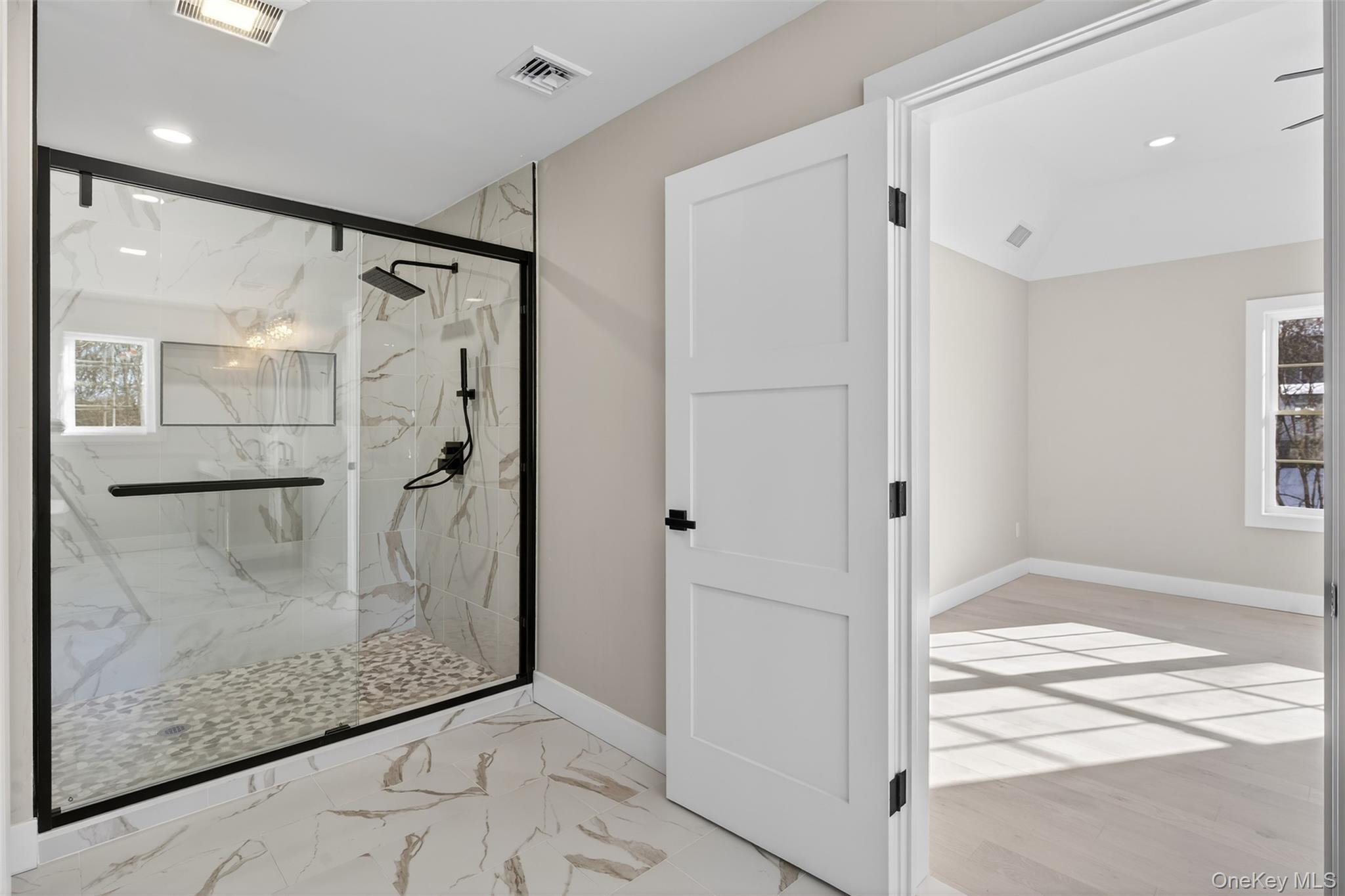 14 Harness Road Goshen, NY 10924 - Photo 31 of 40 Bathroom with recessed lighting, light marble finish floors, and a marble finish shower
