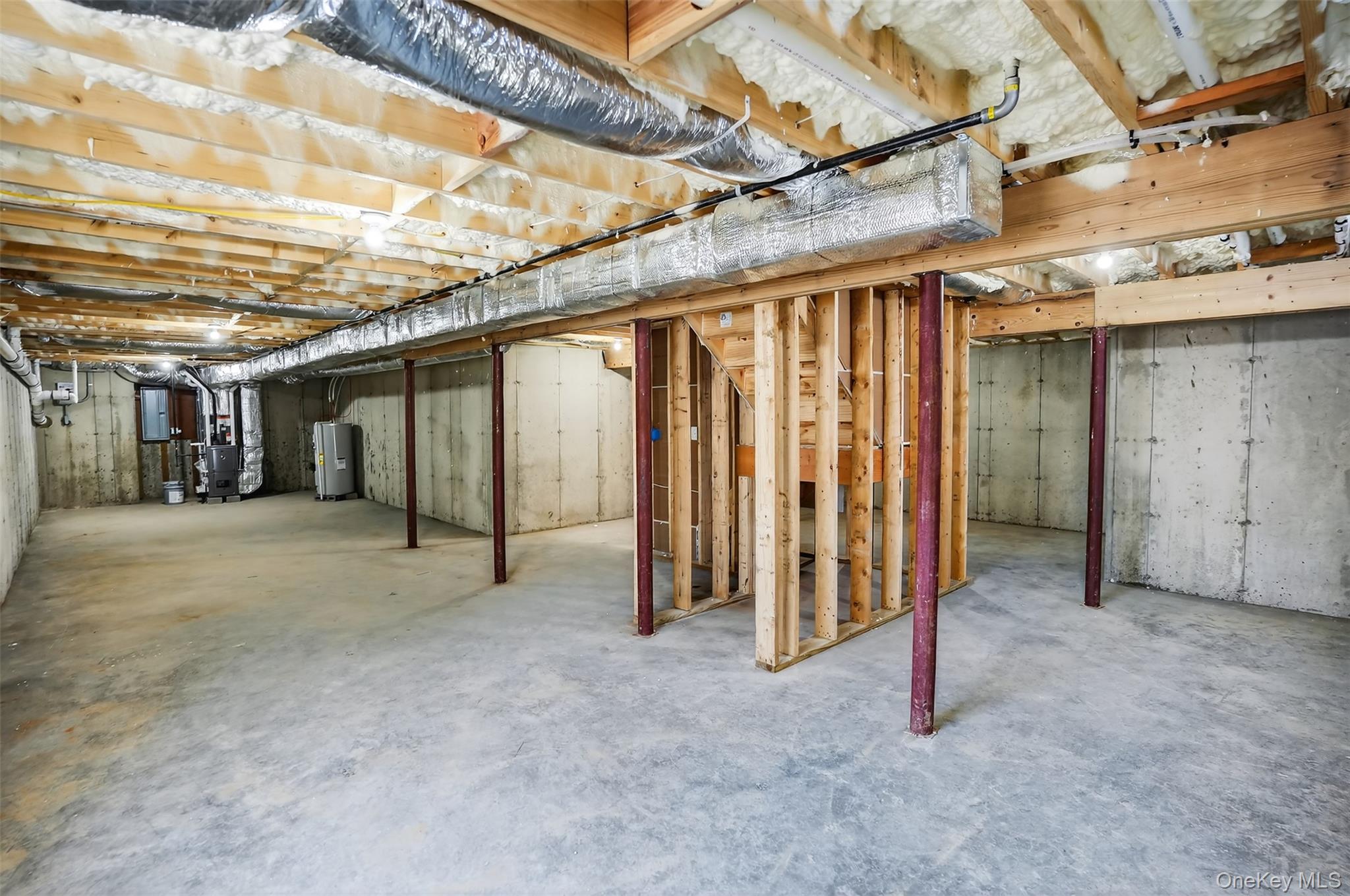 14 Harness Road Goshen, NY 10924 - Photo 38 of 40 Unfinished basement with heating unit, water heater, and electric panel