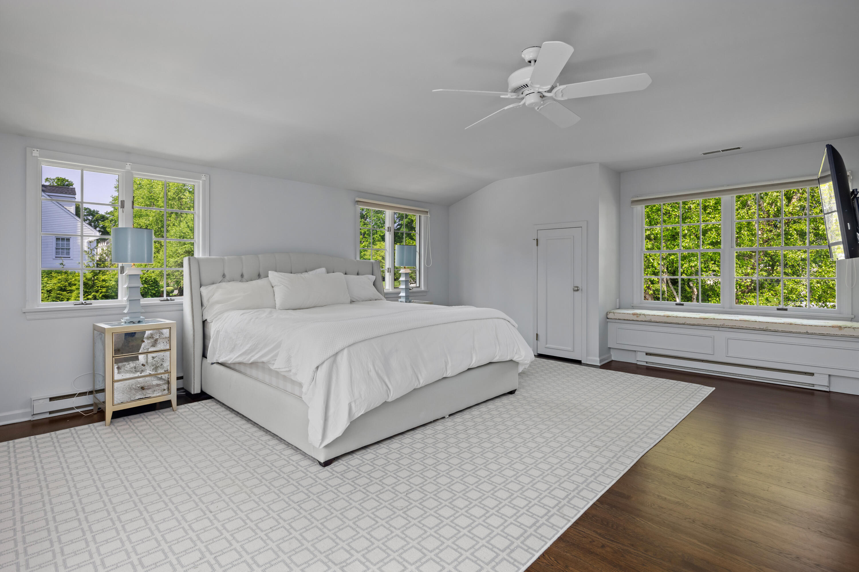 11 Lighthouse Way Darien, CT 06820 - Photo 16 of 25 a bedroom with a bed chandelier and a window