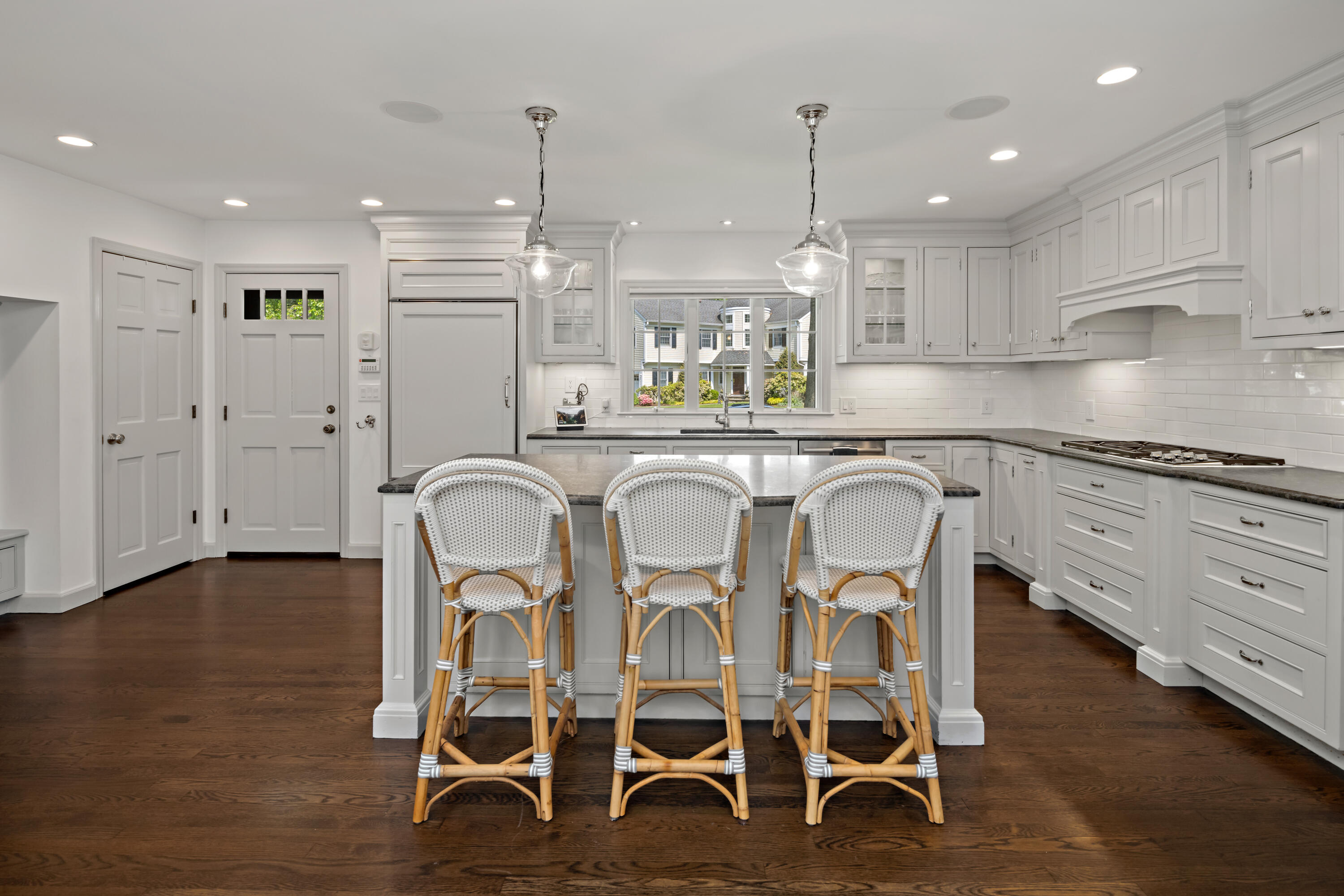 11 Lighthouse Way Darien, CT 06820 - Photo 8 of 25 a kitchen with granite countertop white cabinets and stainless steel appliances
