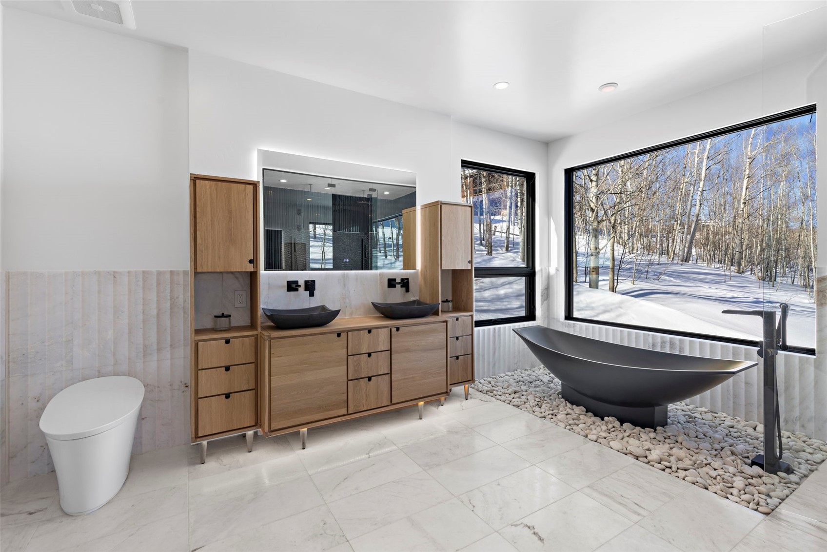 149 Game Trail Road Silverthorne, CO 80498 - Photo 20 of 49 Bathroom featuring vanity, a shower, and tile walls