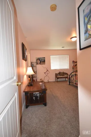 a bedroom with bed and a chandelier
