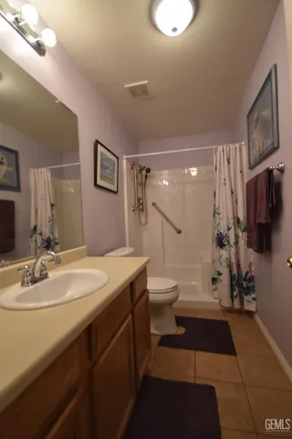 a bathroom with a sink a mirror and cabinets