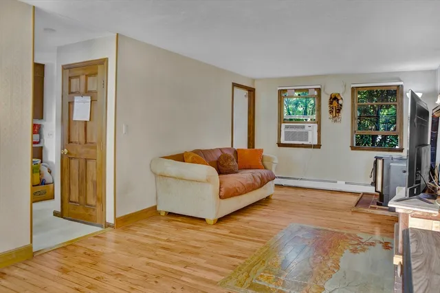 a living room with furniture and windows