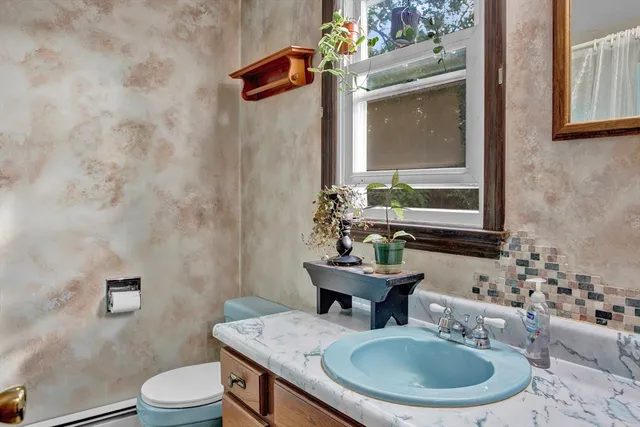 a view of a hallway with a livingroom and a porch