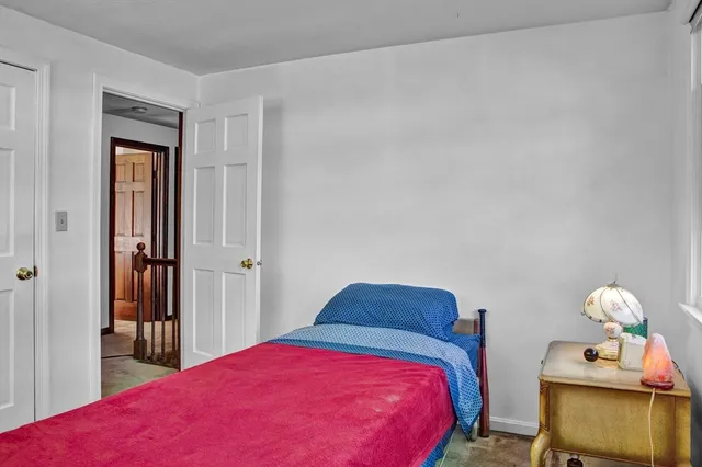 a room with a window and a fan