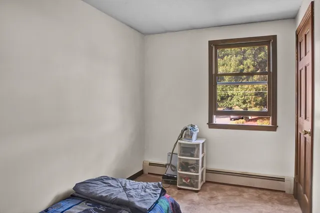 a view of hallway with wooden floor