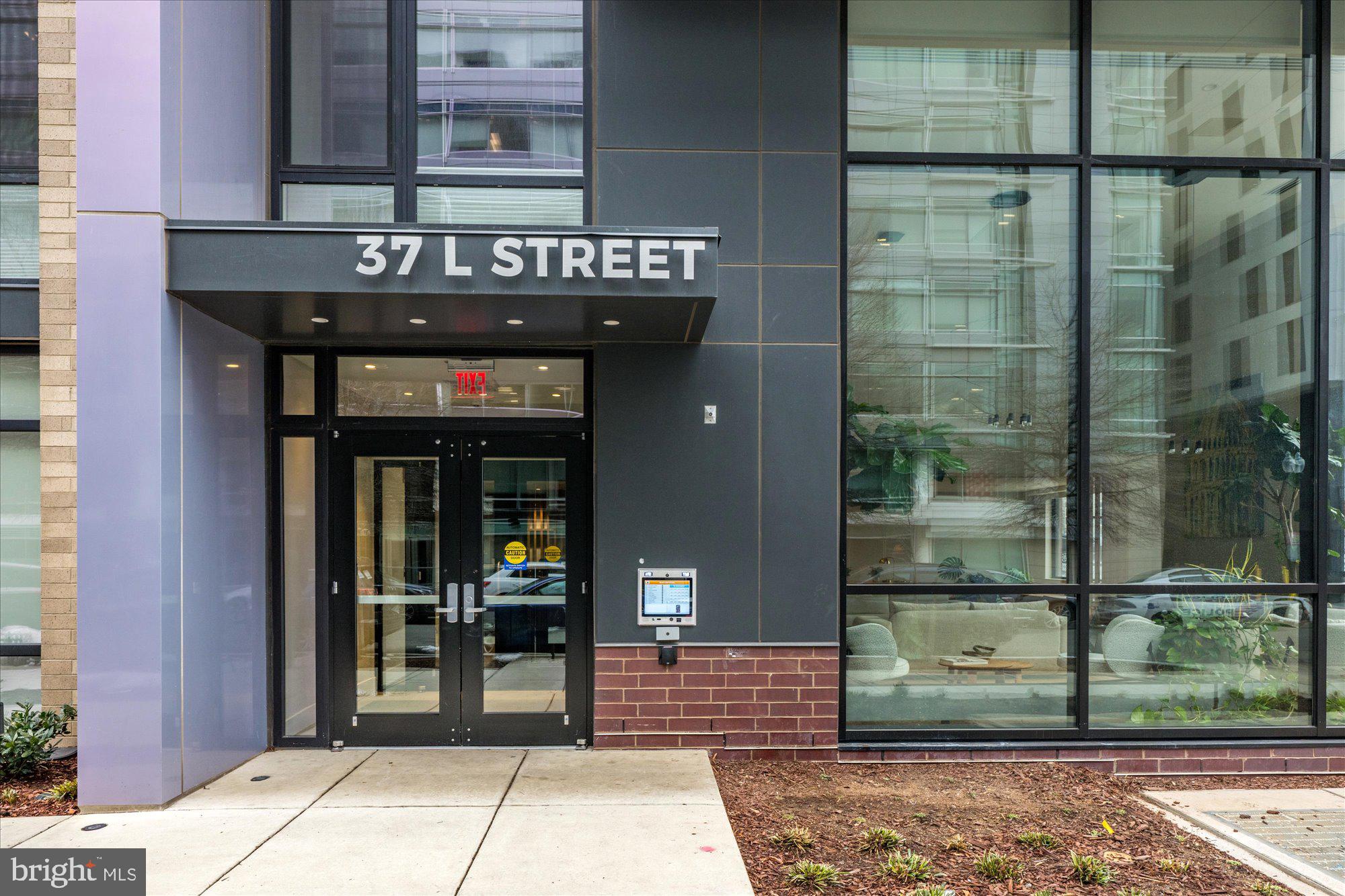 37 L Street Southeast, Unit 1105 Washington, DC 20003 - Photo 2 of 16 a view of a brick building with a building