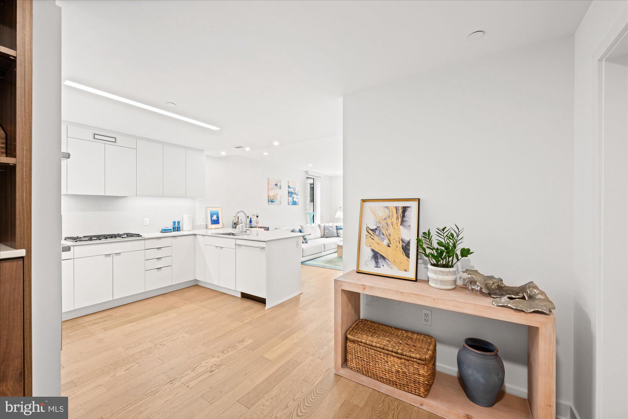 37 L Street Southeast, Unit 1105 Washington, DC 20003 - Photo 4 of 16 a kitchen with a sink cabinets and window