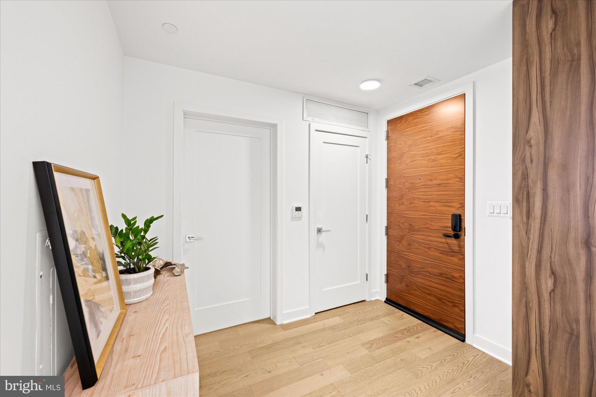 37 L Street Southeast, Unit 1105 Washington, DC 20003 - Photo 5 of 16 a view of an entryway with wooden floor