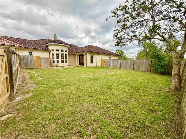 12410 Keith Road Beaumont, TX 77713 - Photo 44 of 45 a large white house with a big yard and large trees