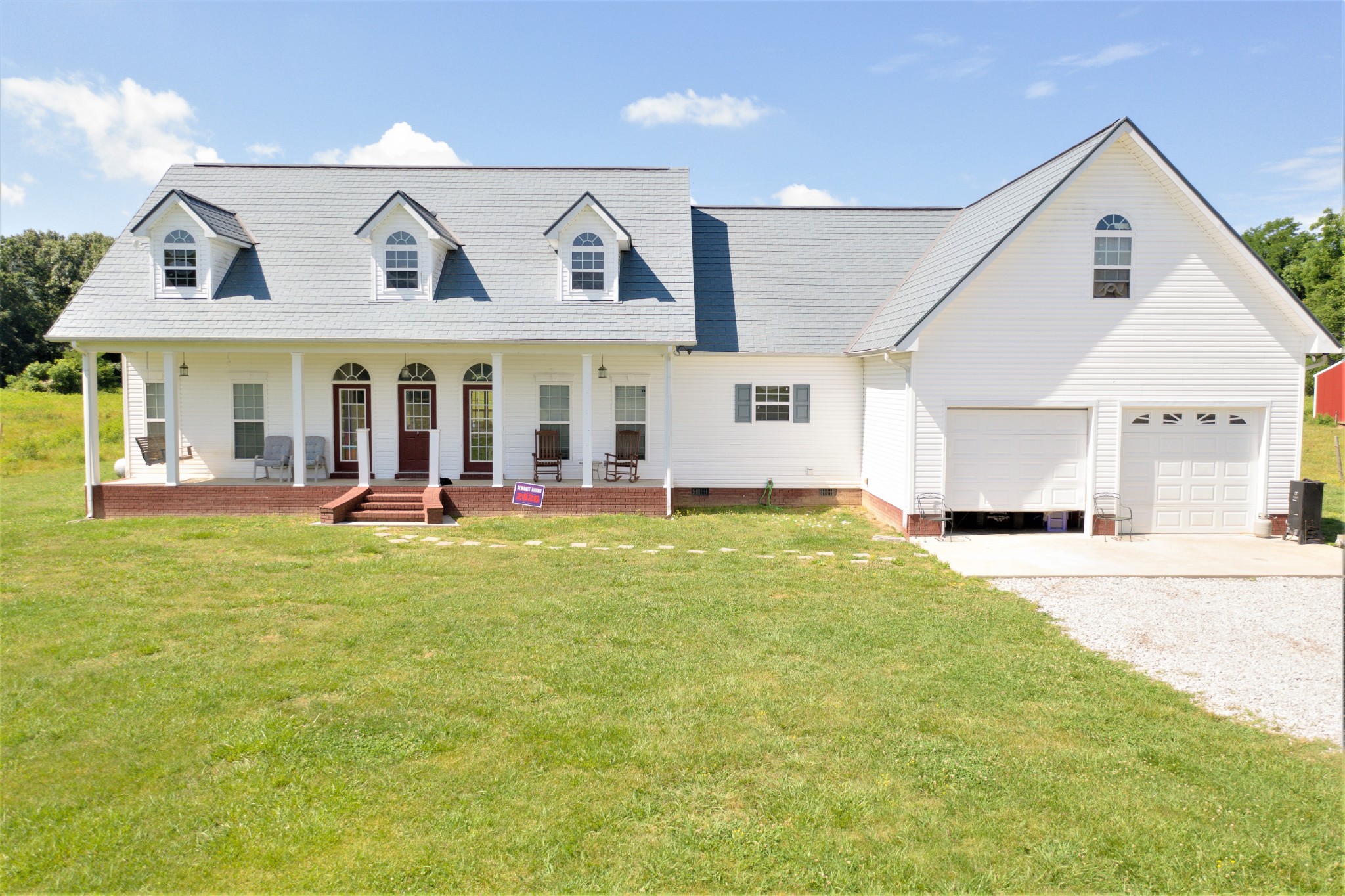602 Spur Road Decherd, TN 37324 - Photo 1 of 1 a view of a house with a backyard space and balcony