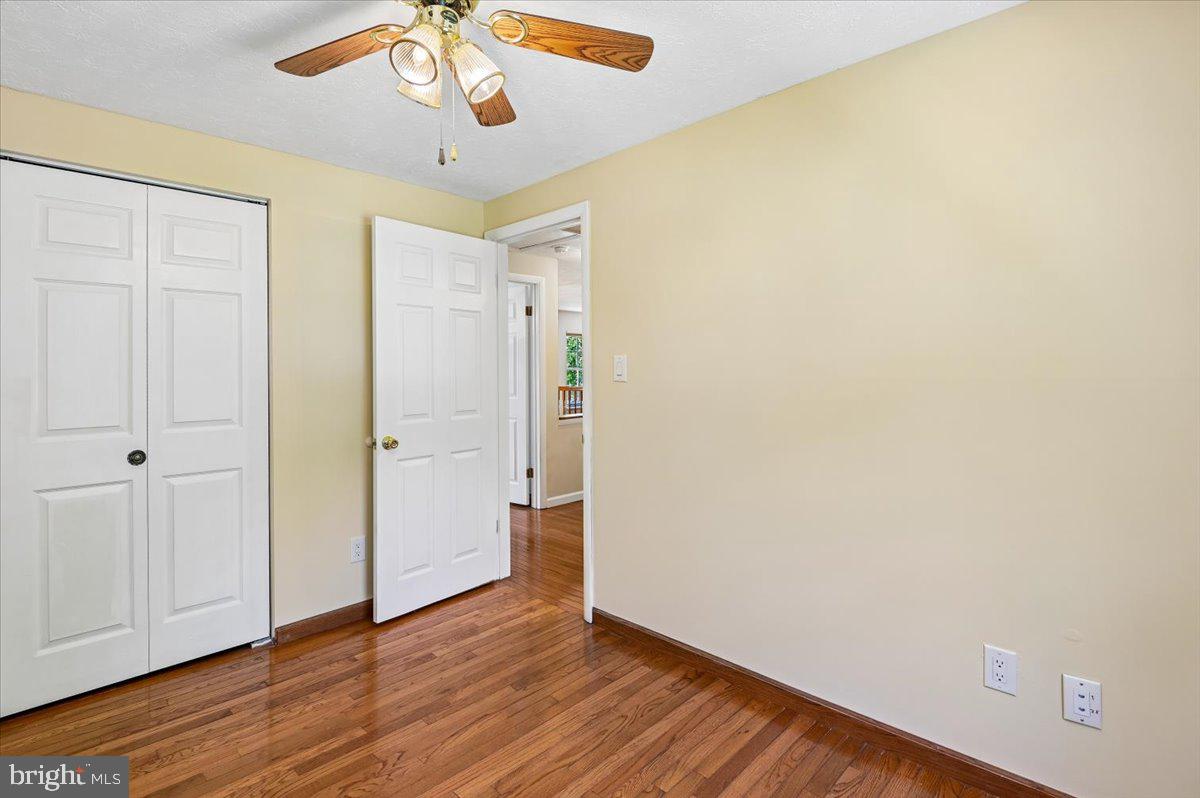 1928 Canonchet Court Hanover, MD 21076 - Photo 17 of 32 a view of an empty room with wooden floor