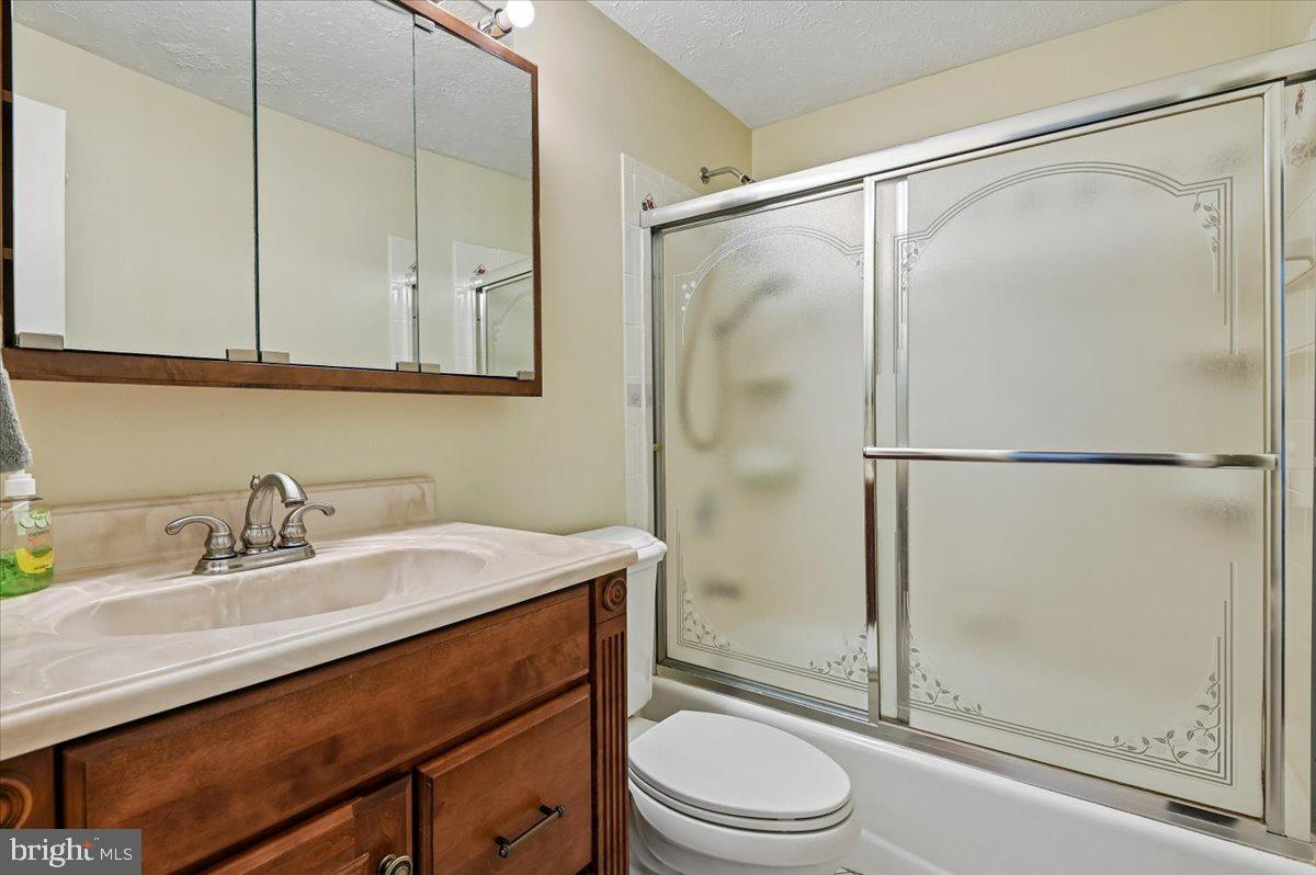 1928 Canonchet Court Hanover, MD 21076 - Photo 18 of 32 a bathroom with a sink toilet and shower