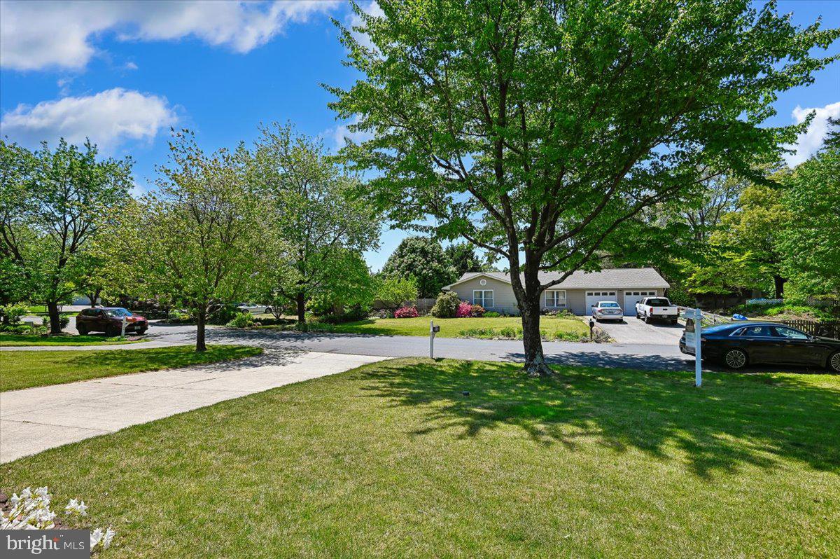 1928 Canonchet Court Hanover, MD 21076 - Photo 27 of 32 a swimming pool with some trees in the background