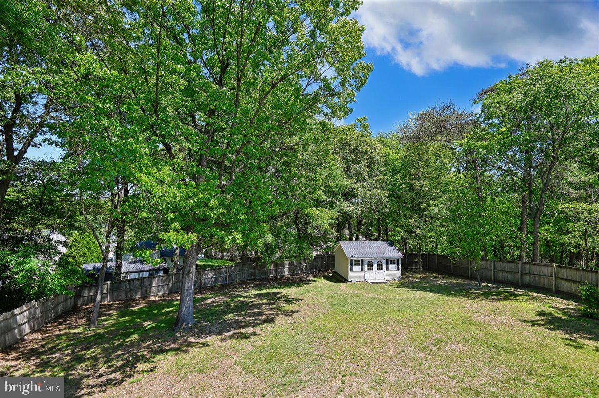 1928 Canonchet Court Hanover, MD 21076 - Photo 29 of 32 a front view of a house with a yard and tree
