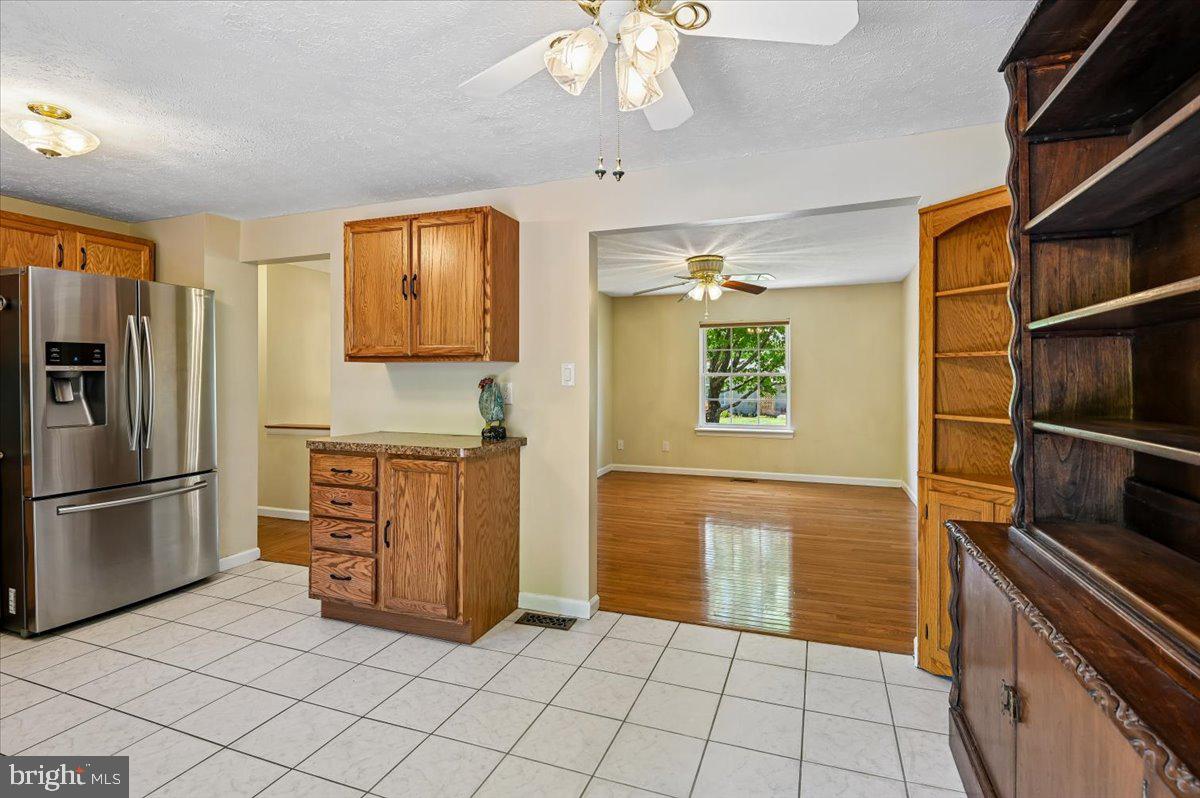 1928 Canonchet Court Hanover, MD 21076 - Photo 5 of 32 a kitchen with stainless steel appliances granite countertop a refrigerator and a sink