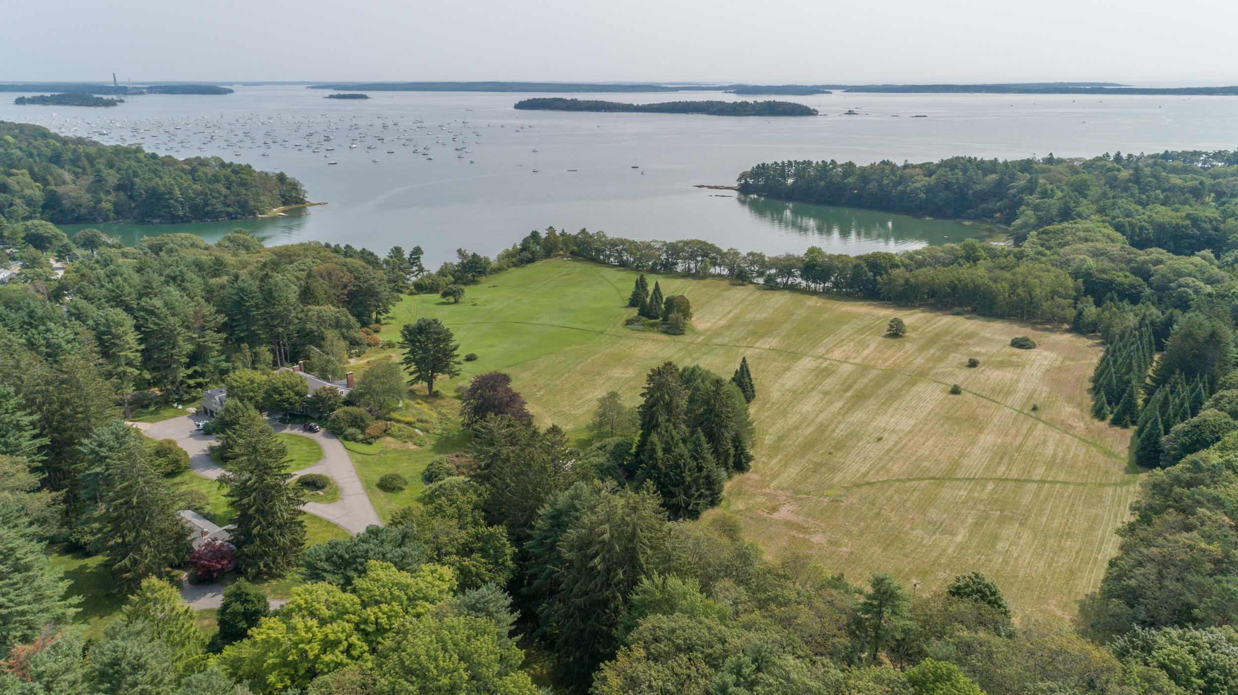 71 Foreside Road, Unit LOT 1 Falmouth, ME 04105 - Photo 1 of 1 71_foreside_aerial_web-30