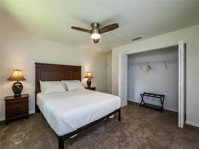 a bedroom with a large bed and a window