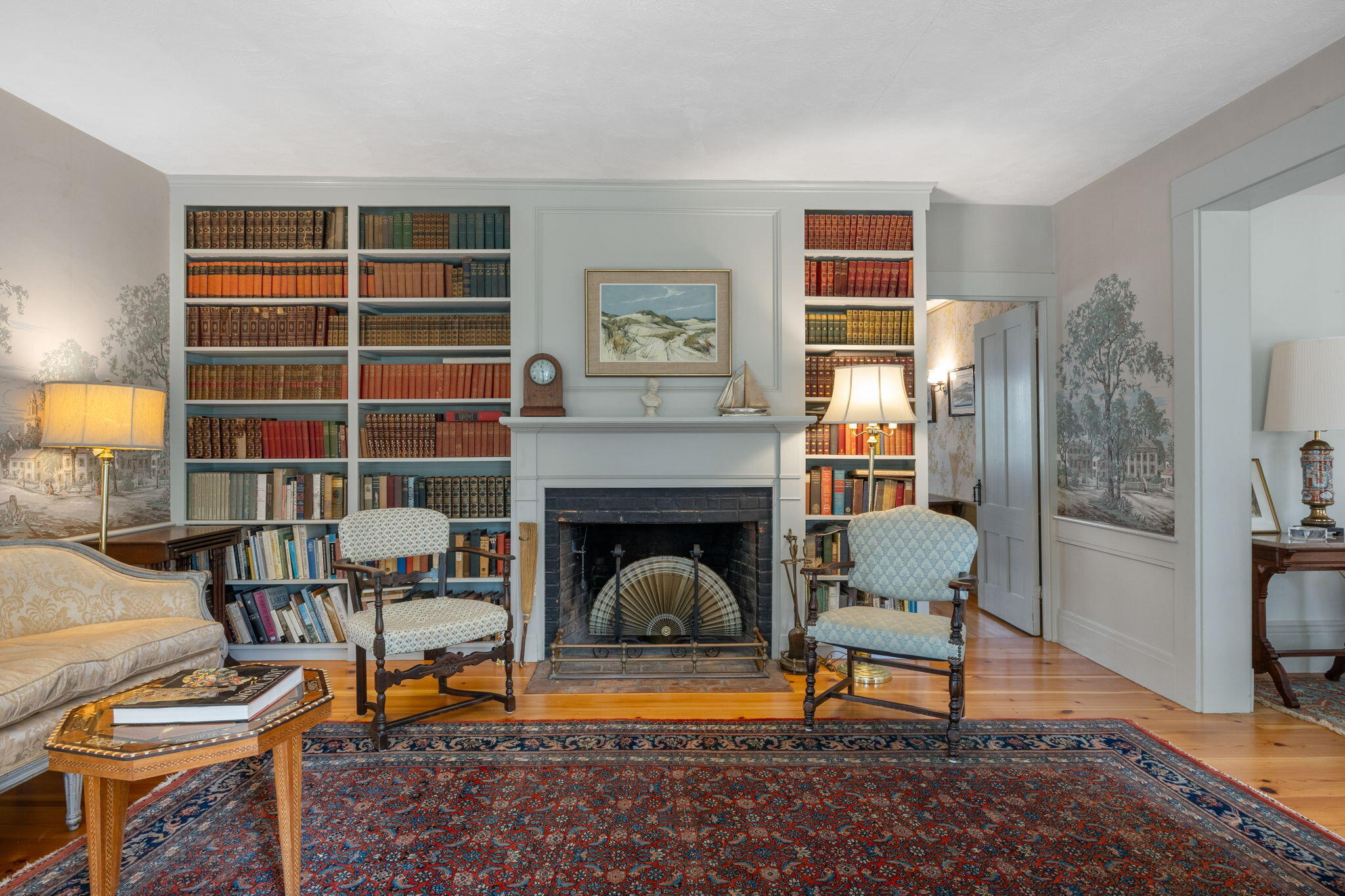 188 Oceanview Avenue Cotuit, MA 02635 - Photo 23 of 76 a living room with furniture a rug and a fireplace