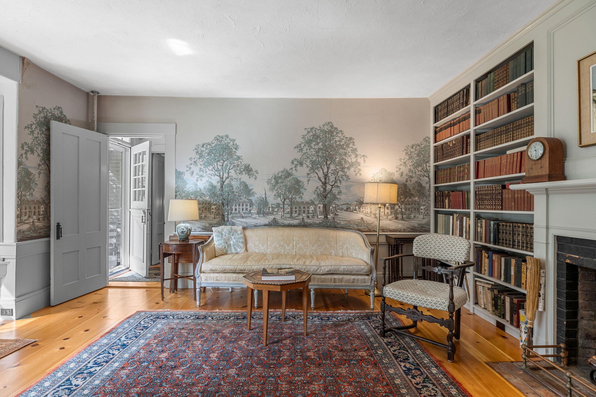 188 Oceanview Avenue Cotuit, MA 02635 - Photo 24 of 76 a living room with furniture and a book shelf