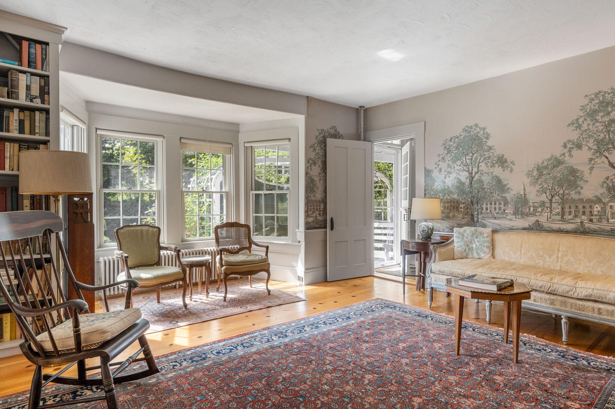188 Oceanview Avenue Cotuit, MA 02635 - Photo 30 of 76 a living room with furniture a rug and a floor to ceiling window
