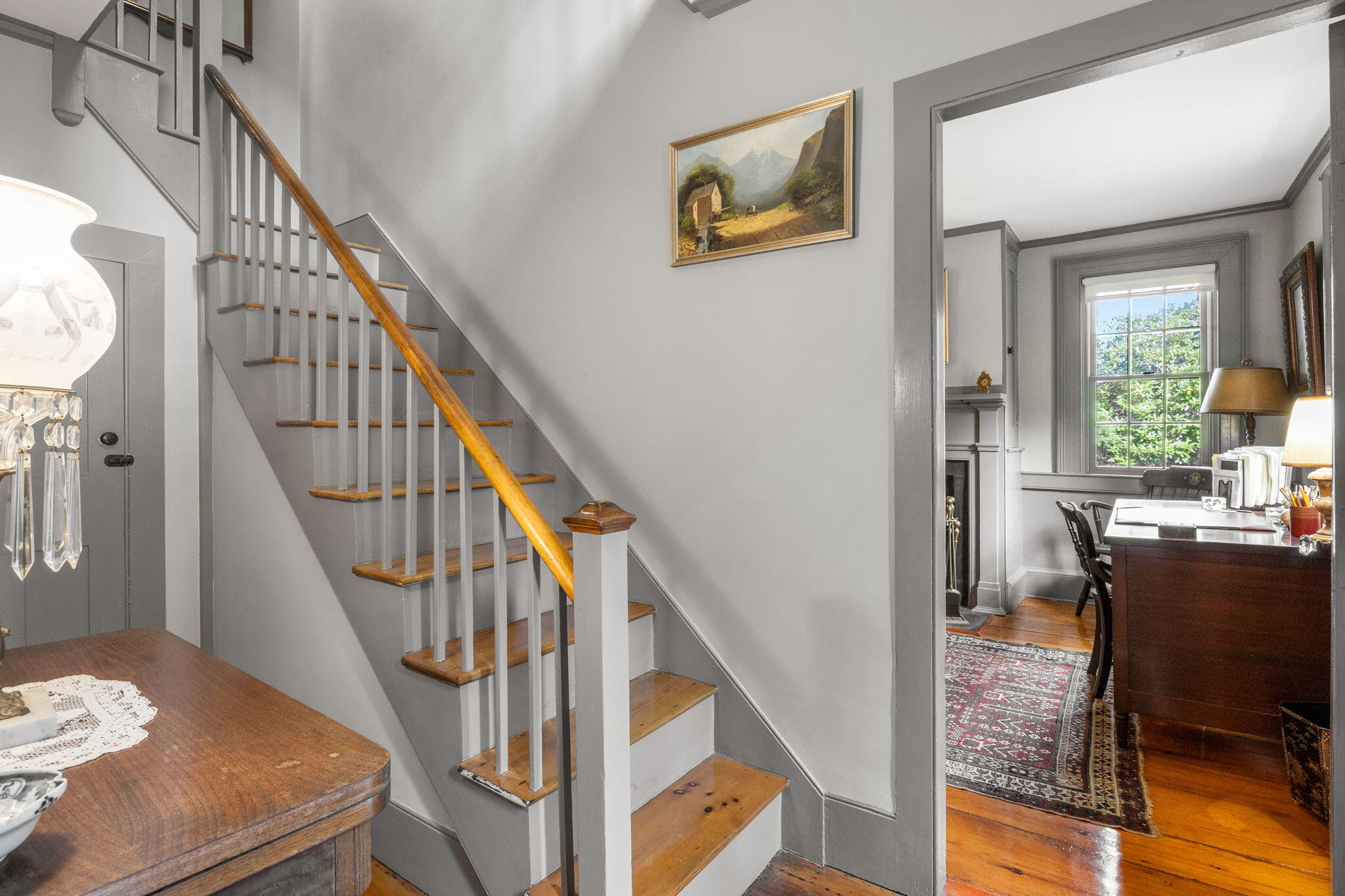 188 Oceanview Avenue Cotuit, MA 02635 - Photo 32 of 76 a view of a livingroom with furniture staircase and wooden floor