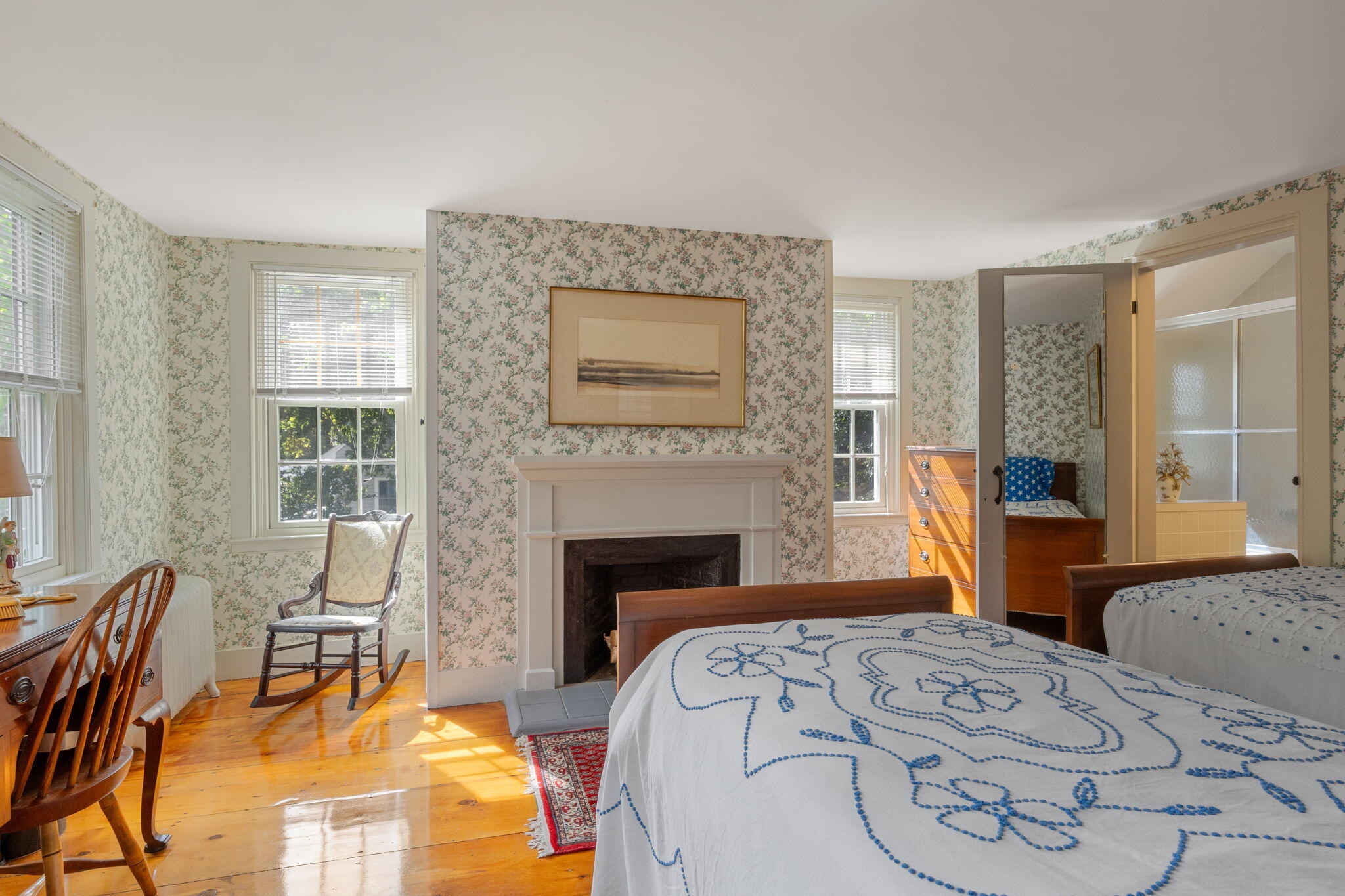 188 Oceanview Avenue Cotuit, MA 02635 - Photo 34 of 76 a bedroom with a bed and a fireplace