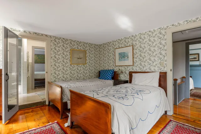 a living room with furniture a rug and a window