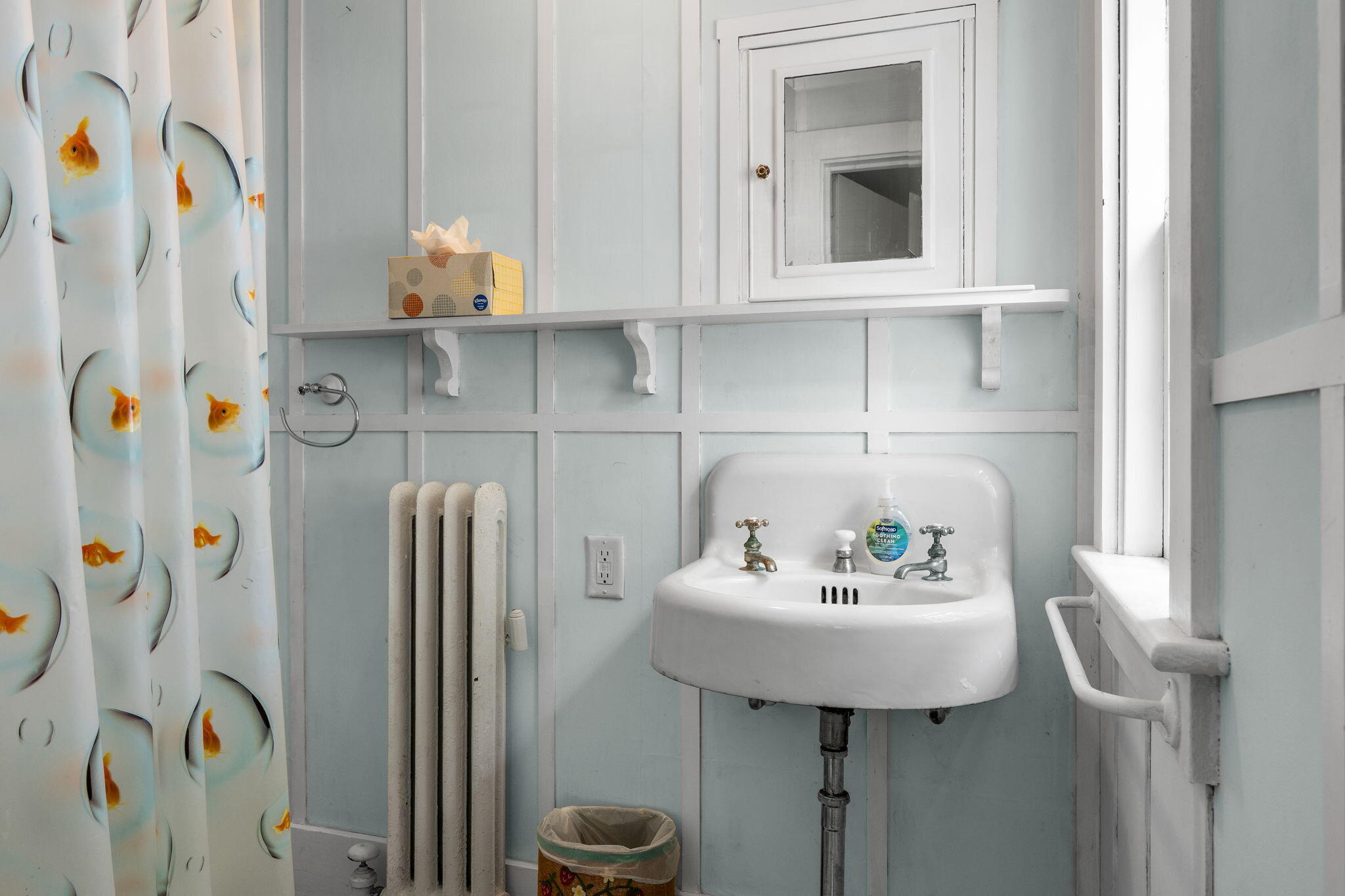 188 Oceanview Avenue Cotuit, MA 02635 - Photo 38 of 76 a bathroom with a sink and a mirror