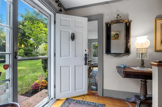a view of a dining room with furniture and window