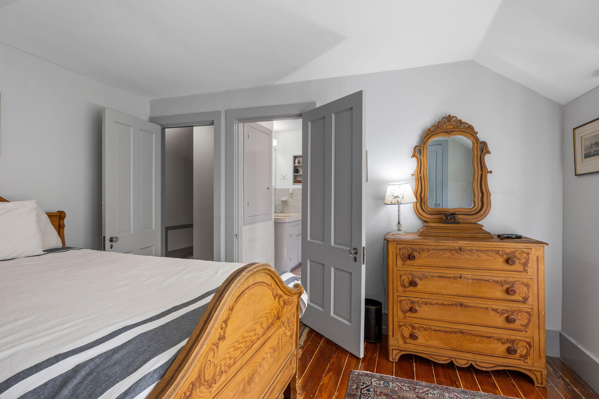 188 Oceanview Avenue Cotuit, MA 02635 - Photo 41 of 76 a bedroom with a bed and a dresser