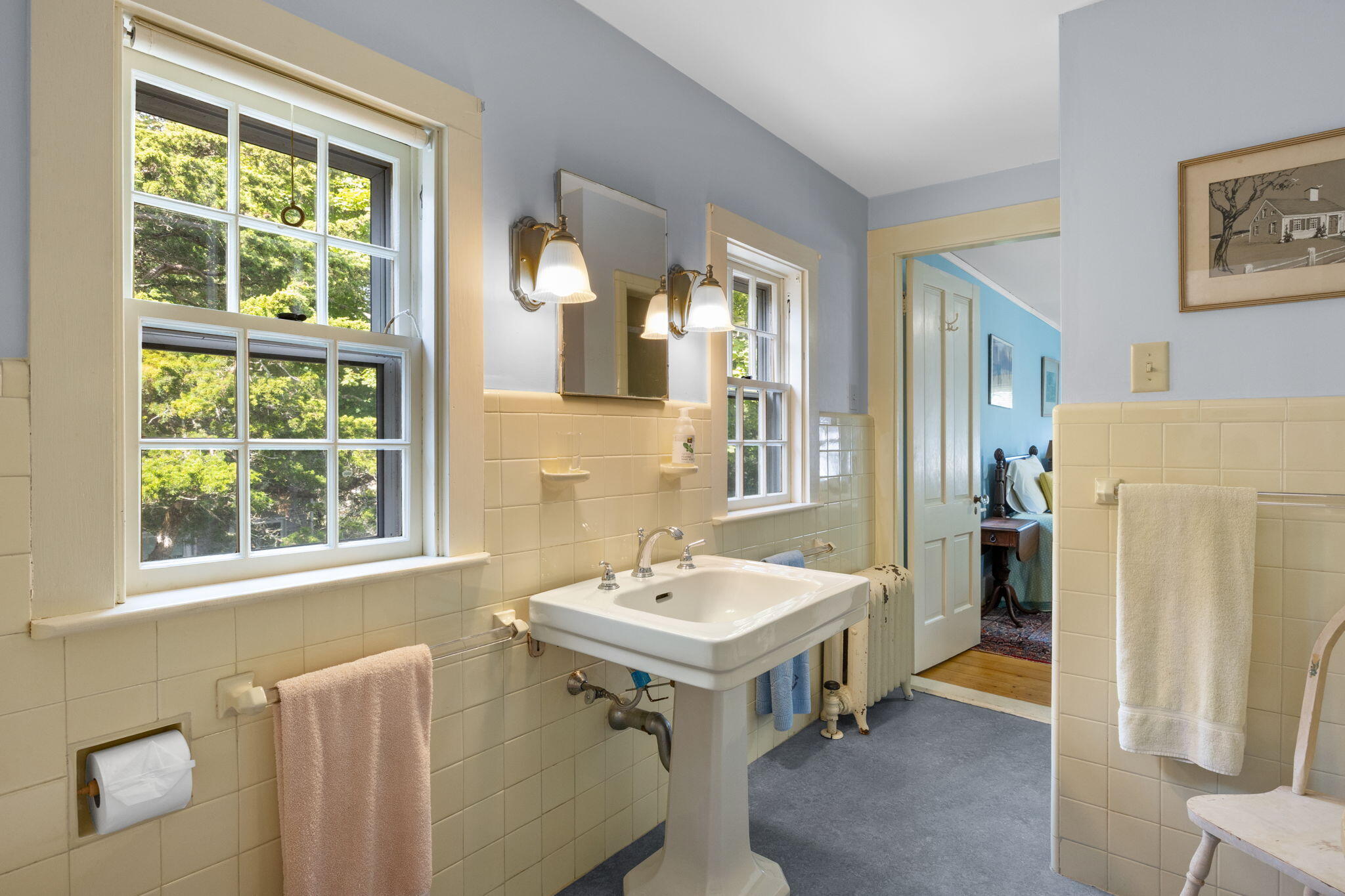 188 Oceanview Avenue Cotuit, MA 02635 - Photo 46 of 76 a bathroom with a sink and a mirror