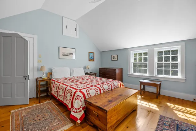 an aerial view of a houses with ocean view
