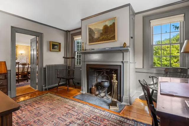 a view of a livingroom with furniture and fireplace