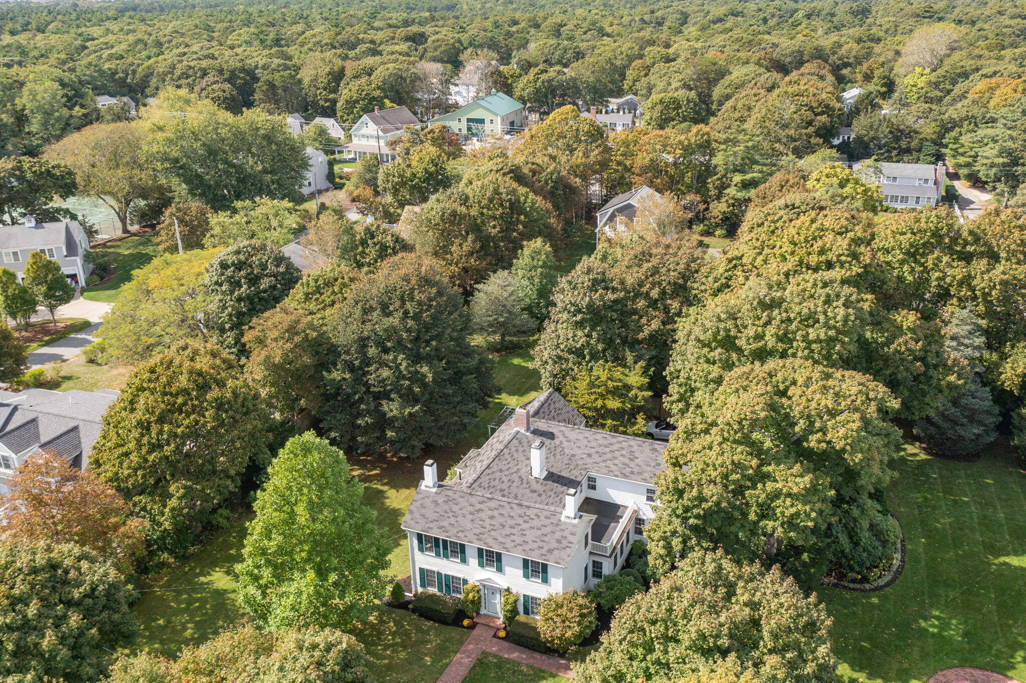 188 Oceanview Avenue Cotuit, MA 02635 - Photo 63 of 76 an aerial view of residential houses with outdoor space and trees