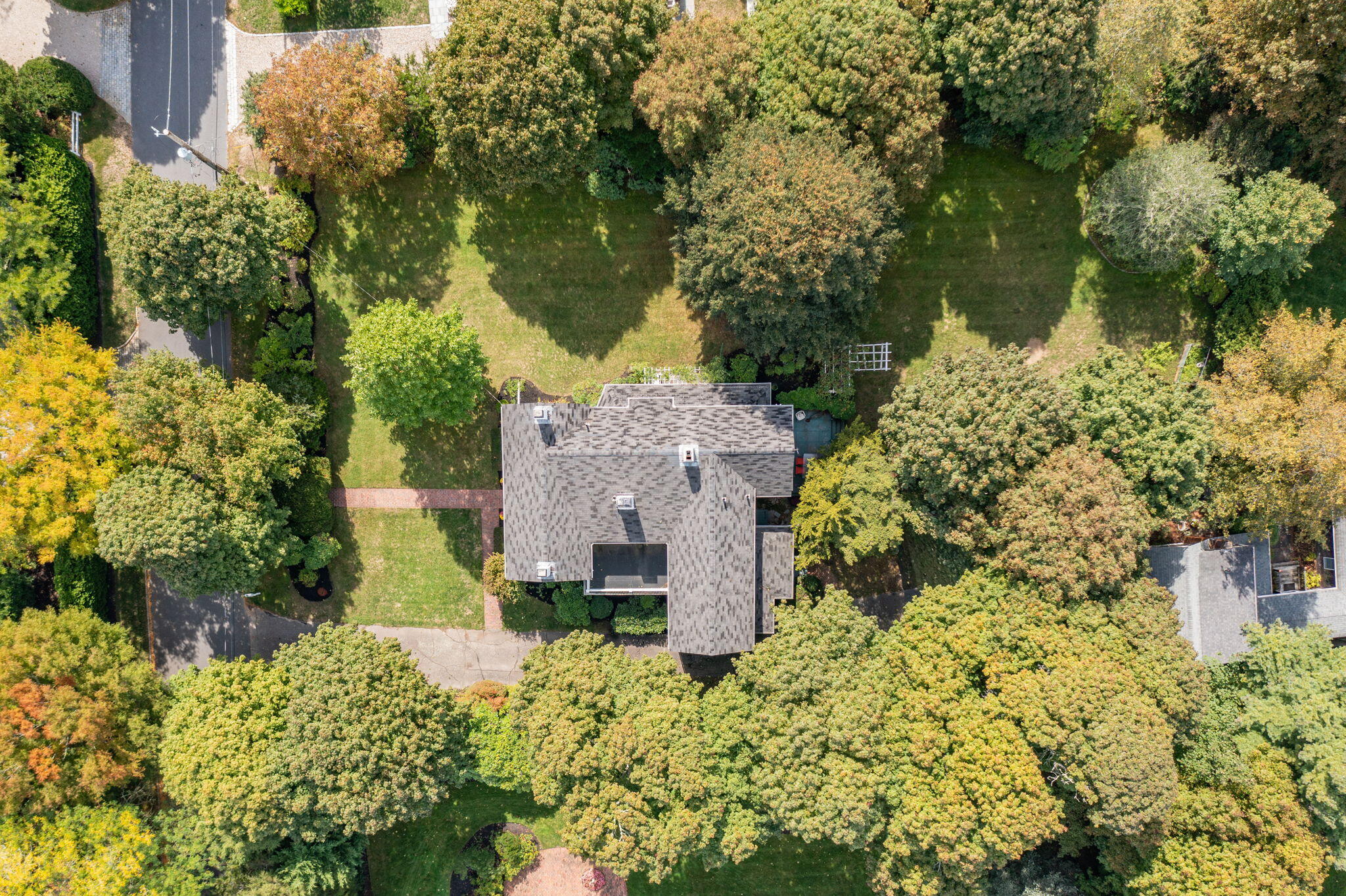 188 Oceanview Avenue Cotuit, MA 02635 - Photo 64 of 76 front view of a house with a yard and large trees
