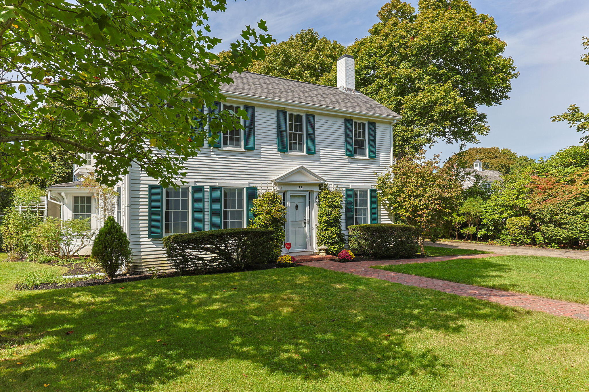 188 Oceanview Avenue Cotuit, MA 02635 - Photo 75 of 76 a front view of a house with a garden