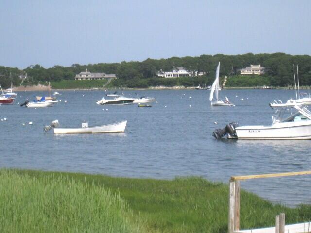 188 Oceanview Avenue Cotuit, MA 02635 - Photo 77 of 81 a view of a lake with a mountain in the background