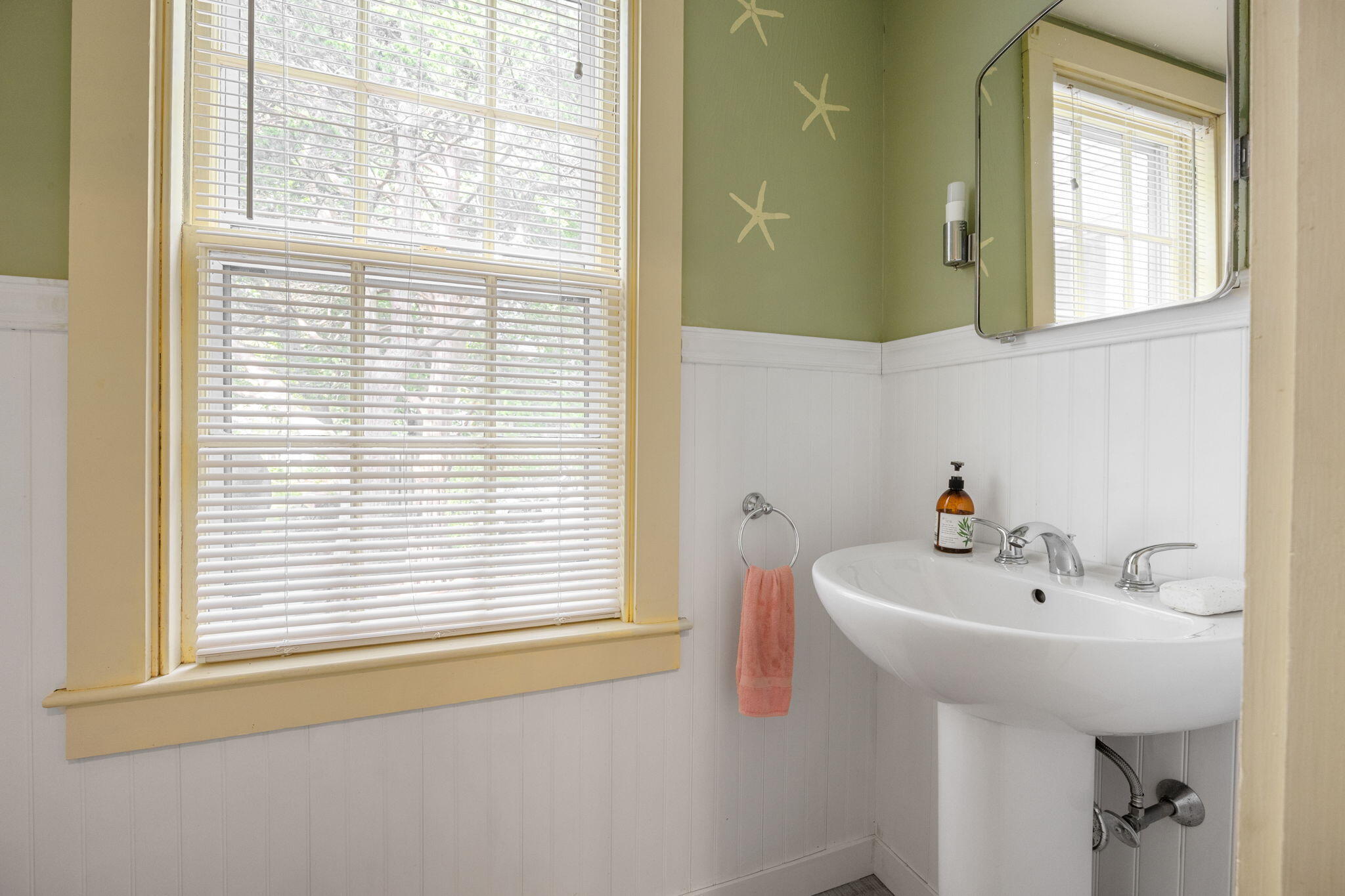 188 Oceanview Avenue Cotuit, MA 02635 - Photo 9 of 76 a bathroom with a sink and a window