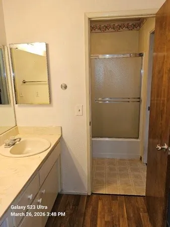 a bathroom with a sink and a mirror