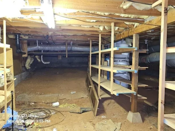 a view of a backyard with wooden fence