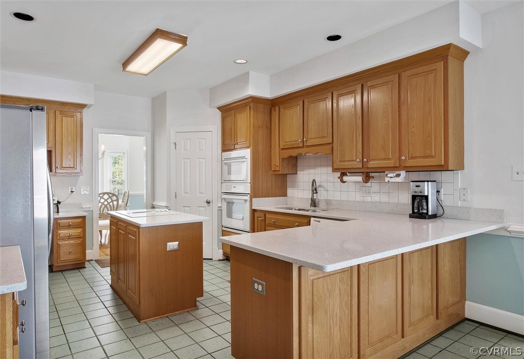 14200 Leafield Drive Midlothian, VA 23113 - Photo 14 of 48 a kitchen with a stove a sink a refrigerator and a cabinets