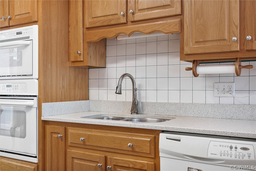 14200 Leafield Drive Midlothian, VA 23113 - Photo 16 of 48 a kitchen with granite countertop white cabinets and a sink